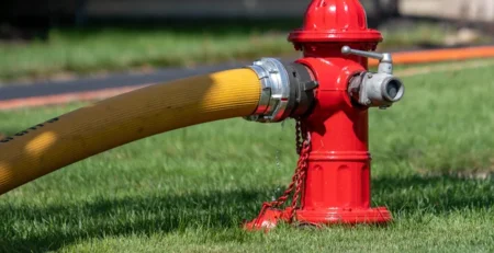 Fire hydrant with hose attached