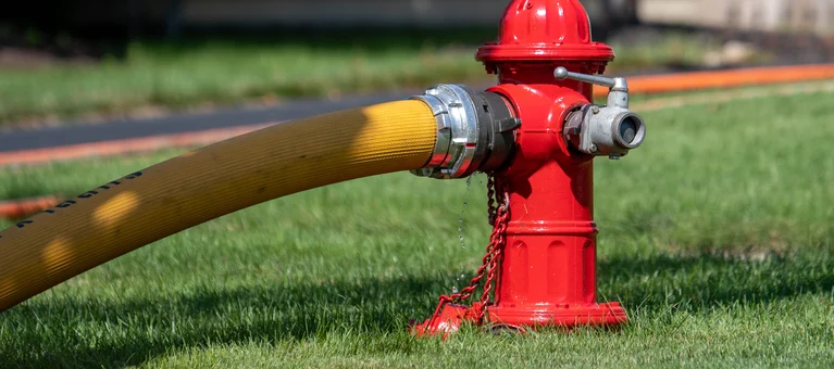 Fire hydrant with hose attached